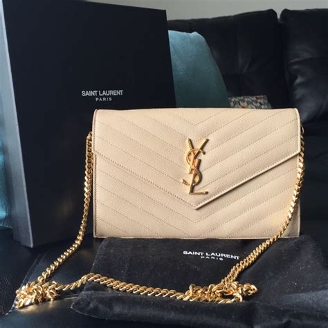 creme ysl bag|YSL cream handbag.